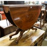 A Victorian figured walnut oval Sutherland table on turned supports and quadripartite scrolled legs,