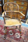 A 19th century Yorkshire area yew and elm Windsor elbow chair with H stretcher, width 58cm, depth