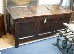 A late 17th century triple panelled oak coffer, length 126cm, depth 51cm, height 63cm