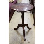 A George III oak tripod table, with circular top and slender baluster stem, diameter 46cm height