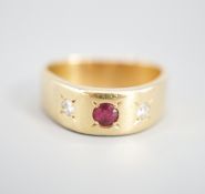 An 18ct and gypsy set three stone ruby and diamond ring, of triangular form, size O/P,gross weight