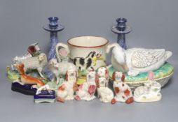 A Staffordshire pottery ‘duck’ tureen and cover, 23cm, a pair of faience candlesticks, Staffordshire