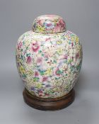 A Chinese thousand flower famille rose jar and cover, early 20th century, wood stand 28cm