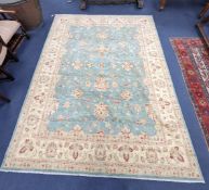 A modern Tabriz style pale green ground carpet, 304 x 240cm