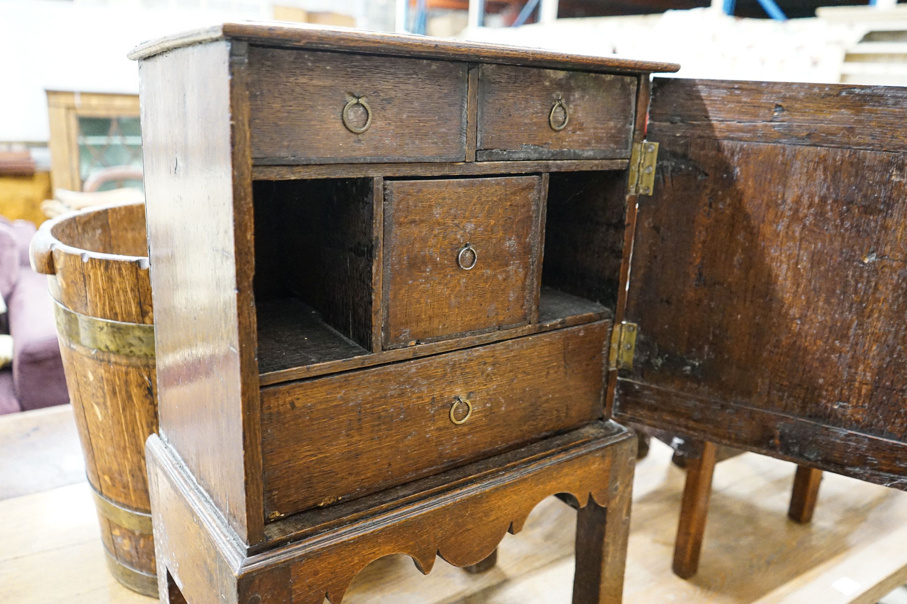 A late 17th century oak spice cupboard, with geometric panelled door enclosing five small drawers, - Image 4 of 6