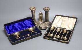 A pair of silver dwarf candlesticks(a,7.f.), 13cm, a small silver trinket box, a silver pepperette