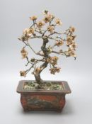 An early 20th century Chinese coloured glass and lacquer model of a tree in a jardiniere 35cm