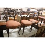 A set of six Victorian carved rosewood balloon back dining chairs