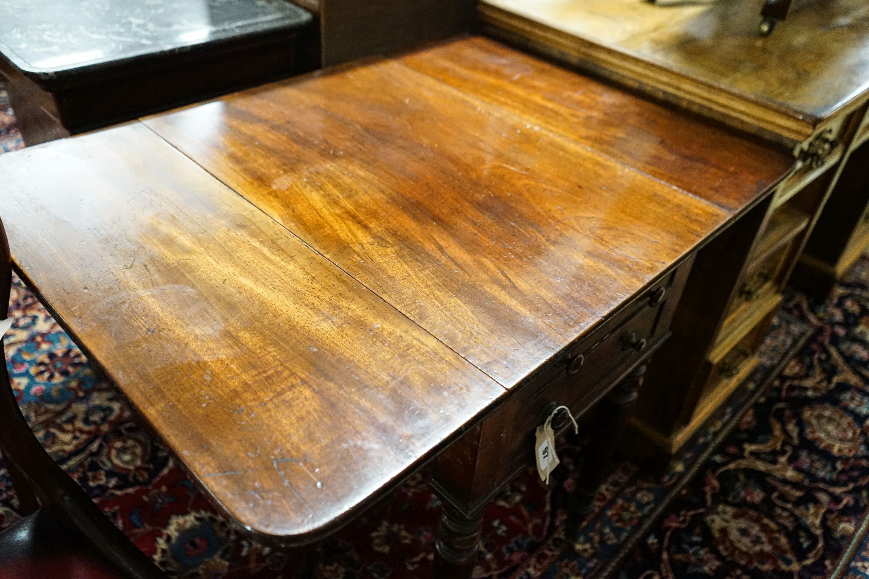 An early Victorian mahogany Pembroke work table, with twin flaps, two drawers, on turned legs and - Image 2 of 3