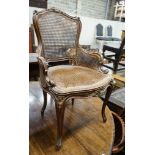 A 19th century French carved and caned walnut salon chair, width 52cm, depth 46cm, height 87cm