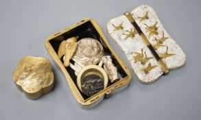 Two Japanese lacquer boxes, an ivory and bronze manju, an ivory ‘lion’ two-piece belt buckle and two