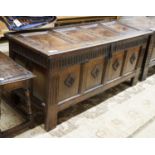 A late 17th century oak coffer, with four panel top and carved front, length 151cm, depth 58cm,