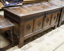 A late 17th century oak coffer, with four panel top and carved front, length 151cm, depth 58cm,