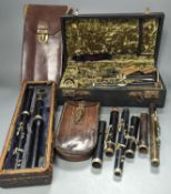 Three ebony or rosewood flutes and a clarinet