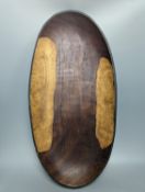 A large early 20th century West African hewn hardwood bowl raised on squared legs, width 63cm
