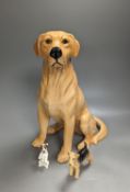 A Royal Doulton figure of a seated Labrador (No. 2314), height 34cm, a small Beswick Airedale