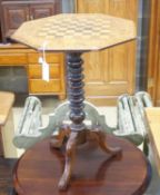 A Victorian octagonal walnut tripod games table, width 50cm height 67cm