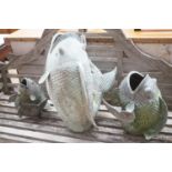 Three cast metal carp garden ornaments, largest 60cm height 46cm