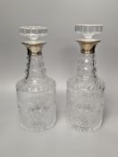 A pair of silver mounted glass decanters, with stoppers, height 28cm
