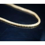 A continental yellow metal necklace, 38cm, 7.7 grams.