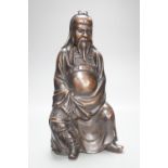 A large Chinese silver inlaid bronze seated figure of Guandi, Shishou mark, height 36cm