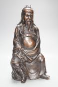 A large Chinese silver inlaid bronze seated figure of Guandi, Shishou mark, height 36cm