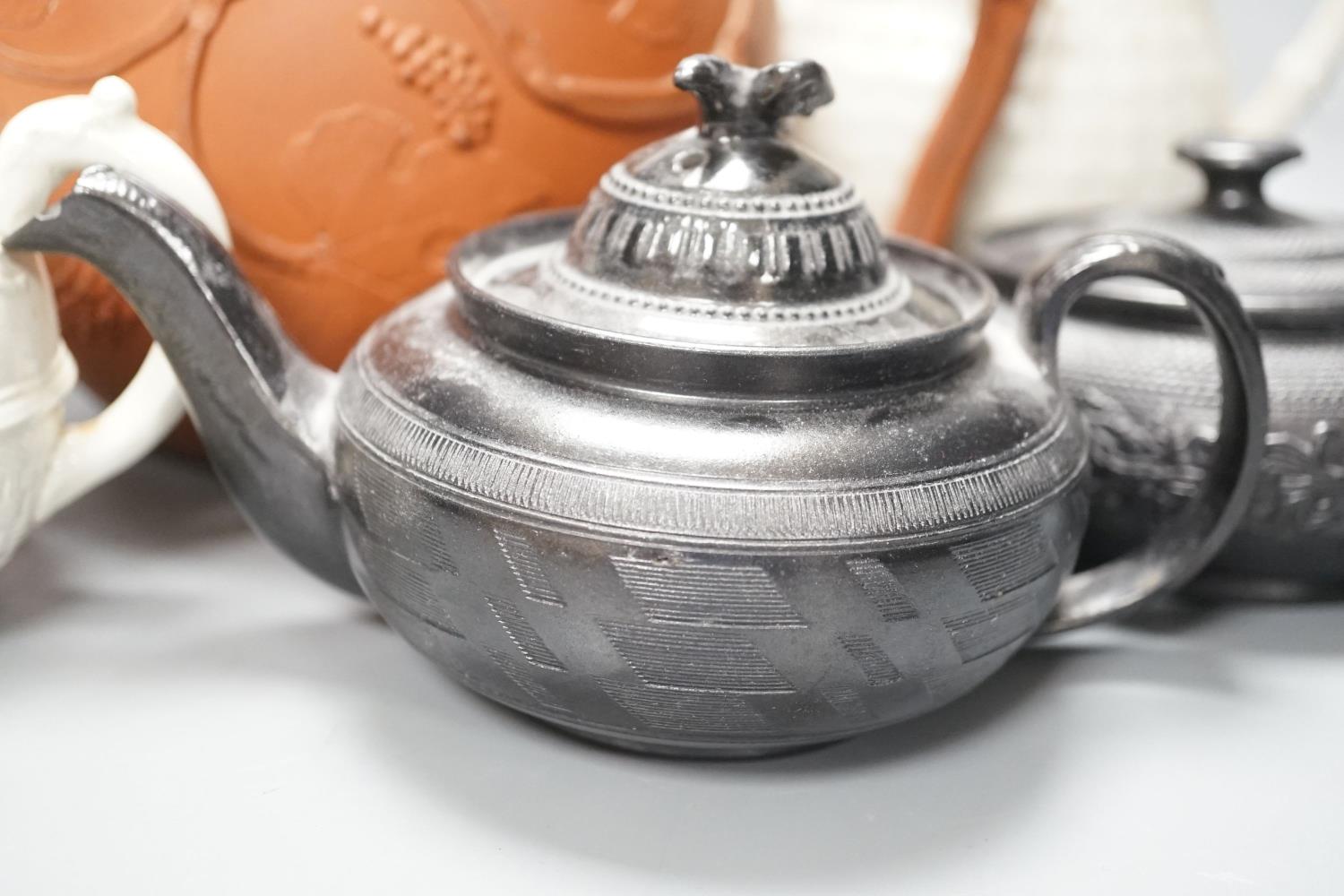 Four 19th century black basalt or black glazed pottery teapots, a large red ware teapot, a creamware - Image 3 of 12