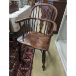 A near pair of mid 19th century Nottingham Area yew and elm Windsor elbow chairs with crinoline