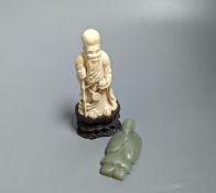 An early 20th century Chinese carved ivory figure of Shao Lao on stand and a jade figural carving