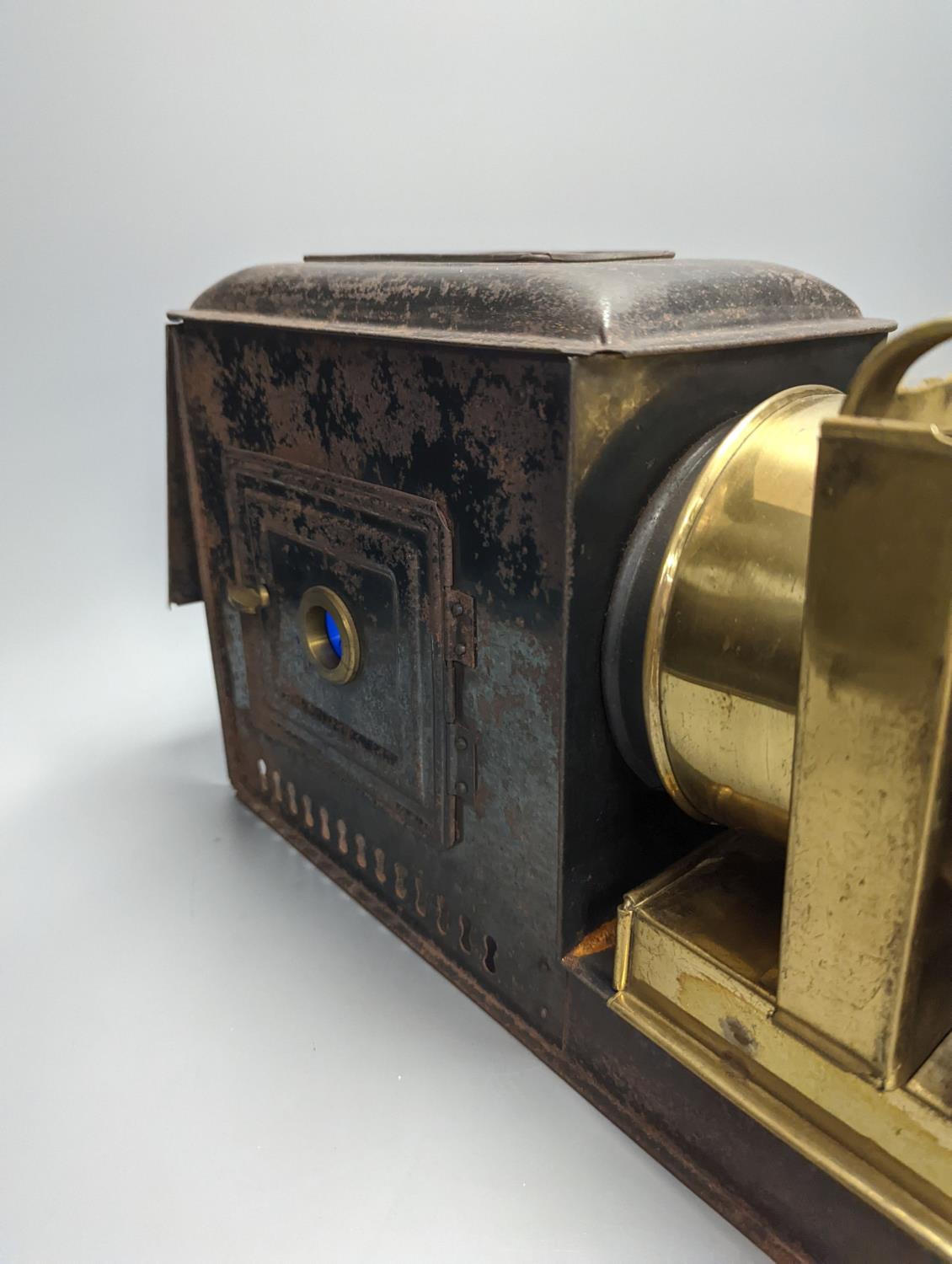 A cased tinplate and pressed brass Magic Lantern, Case 46 cm long - Image 3 of 4