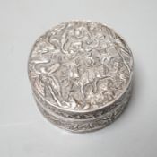 A Chinese embossed white metal circular box and cover, late 19th century, diameter 61mm.
