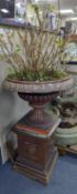 A Victorian glazed earthenware campana garden urn on square plinth, height 99cm