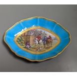 A 19th century Sevres oval shaped dish painted with a hunt scene, with three gentlemen, two dogs two