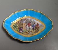 A 19th century Sevres oval shaped dish painted with a hunt scene, with three gentlemen, two dogs two