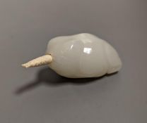 A Chinese white jade 'toad' snuff bottle, the stone of excellent even tone, 8cms long, including