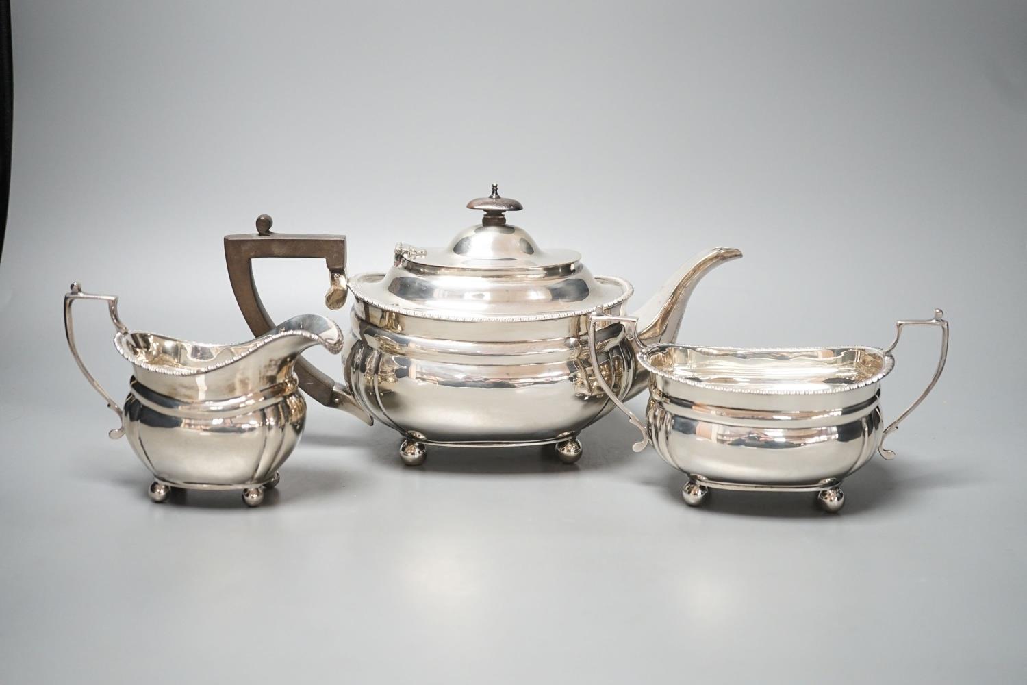 A George V silver three piece tea set, Charles Stuart Harris & Son Ltd, London, 1917, gross 28oz. - Image 6 of 6