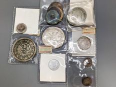 A group of Chinese coins,Including a Hong Kong dollar 1902, 20 cents 1891, 5 cents 1891 and 1892,