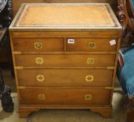 A pair of reproduction brass mounted military style yew veneered bedside chests with leather inset