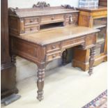 A Victorian carved oak kneehole desk, width 124cm depth 69cm height 110cm