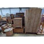 An Art Deco style limed oak three piece bedroom suite and a similar low chest, wardrobe width