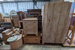 An Art Deco style limed oak three piece bedroom suite and a similar low chest, wardrobe width