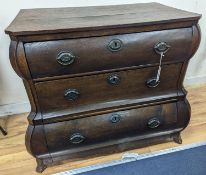 An 18th century Dutch oak three drawer bombe chest, width 94cm, depth 50cm, height 76cm