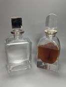 A silver mounted triangular glass decanter and a similar oblong spirit decanter, both with silver