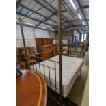 A Victorian style brass four poster double bed frame, with an Odd Mattress Company Hampton 150cm