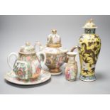 A 19th century Chinese famille rose teapot, sugar bowl, saucer dish vase and a similar yellow ground