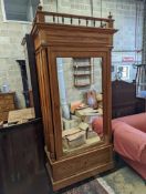 A 19th century French pitch pine mirrored armoire, width 107cm, depth 48cm, height 232cm