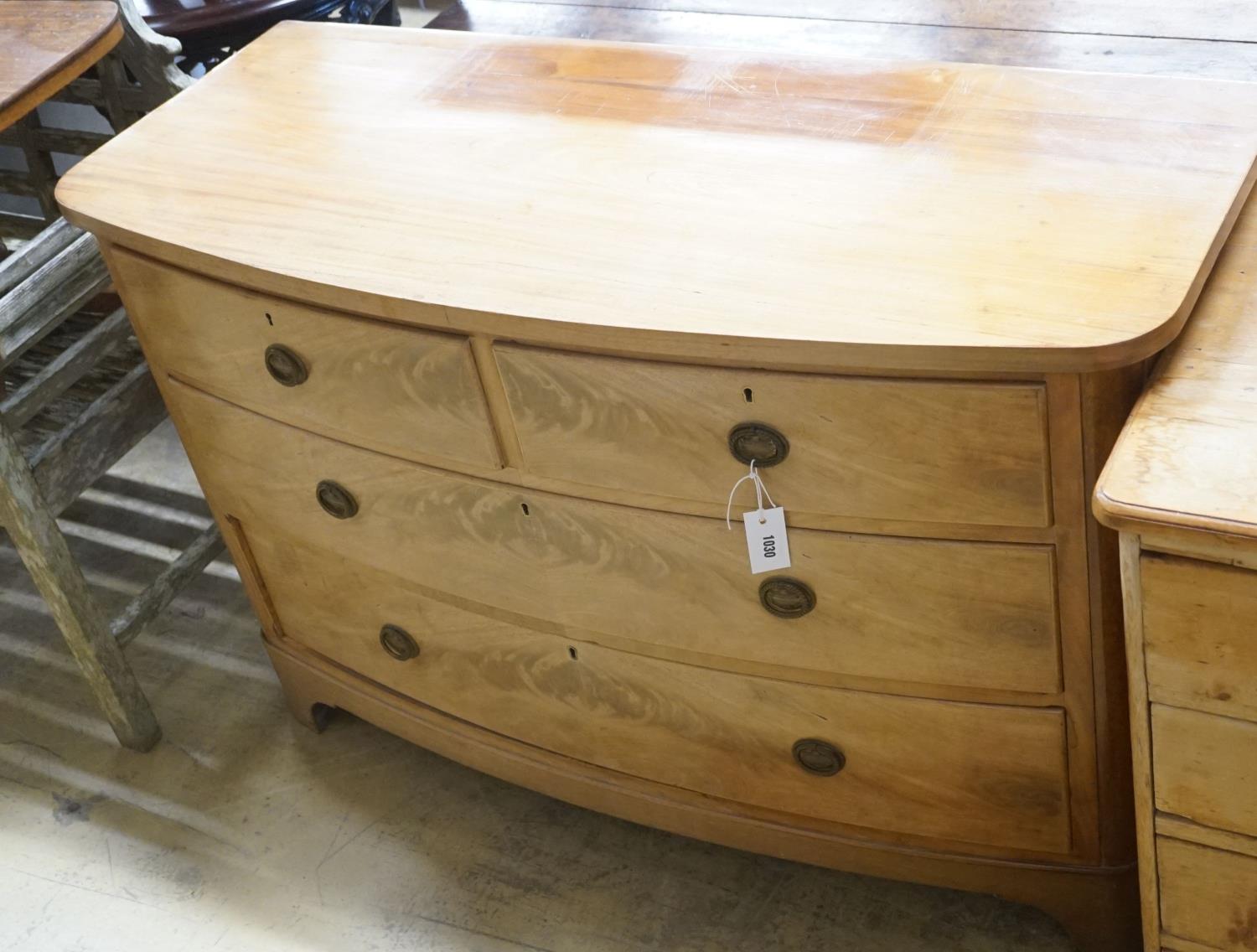 A Regency faded mahogany bow-front chest of three long drawers, width 120cm depth 51cm height 77cm