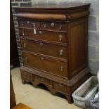 An 18th century oak chest on stand, width 104cm, depth 56cm, height 133cm