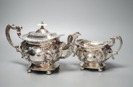 An Edwardian embossed silver teapot and matching sugar bowl, William Aitken, Chester, 1903, gross