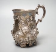 A Victorian embossed silver christening mug, Martin, Hall & Co, Sheffield, 1866, with engraved